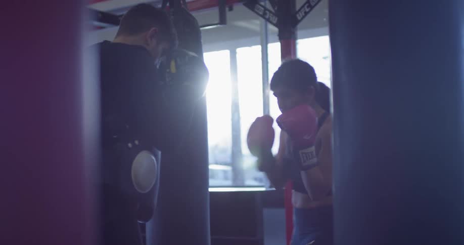 A woman trains to box in a gym