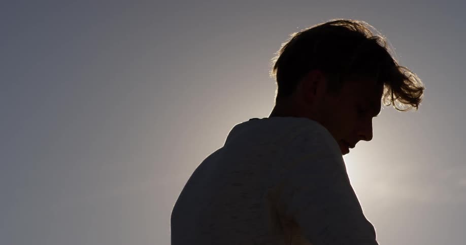 Man standing at sunset