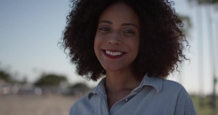 A woman smiles as she walks