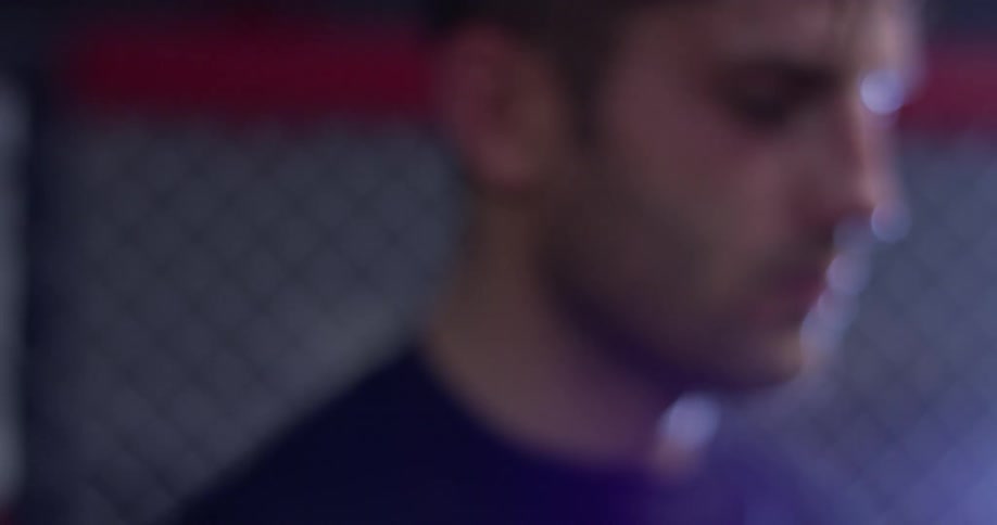 A man sweats in a boxing ring