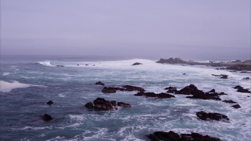 Ocean waves flow towards a shoreline