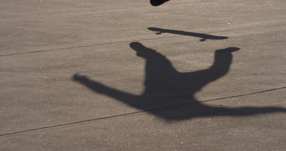 A skateboarder performs a jumping trick