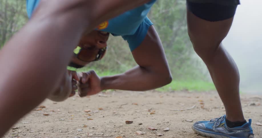 A man stretches and exercises outside