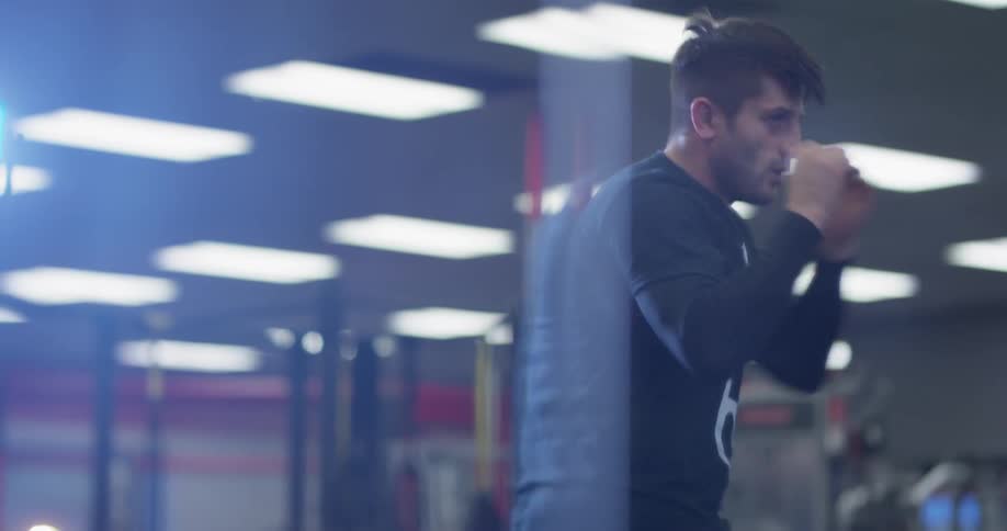 A man trains by throwing punches