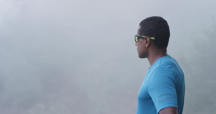 A man watches the heavy fog