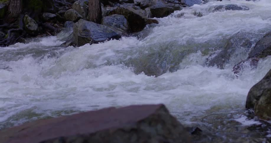 Water rushes down a rocky stream