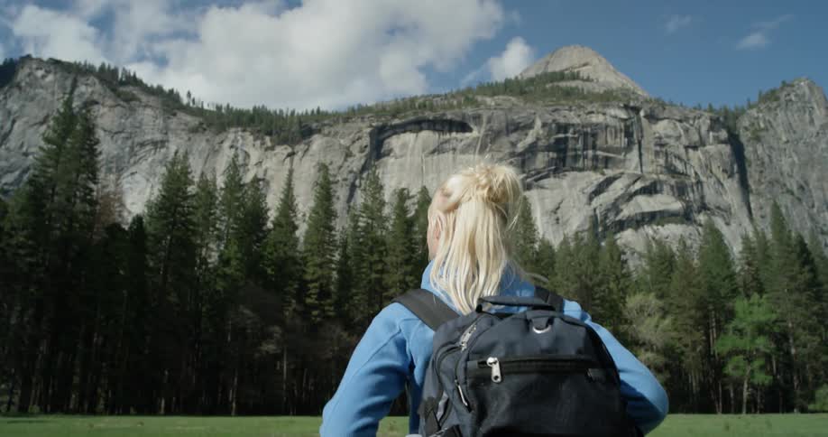 A woman hikes in a forest