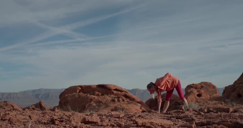 Woman Exercising In The Desert