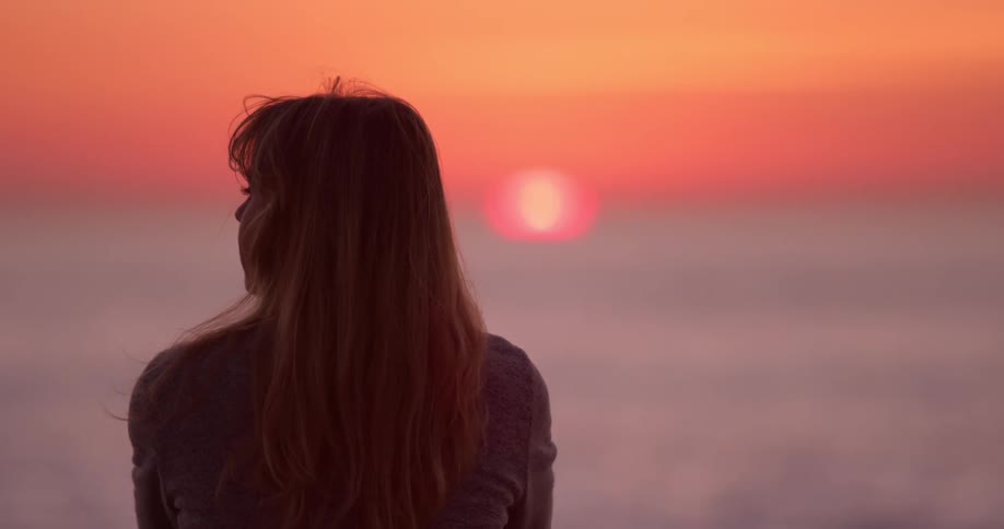 Woman Watching Sunset At Beach