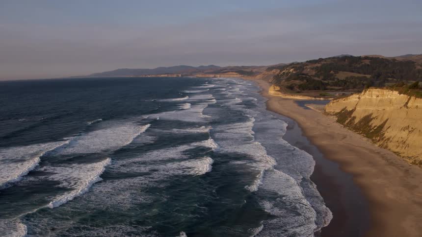 Ocean waves flow towards a shoreline