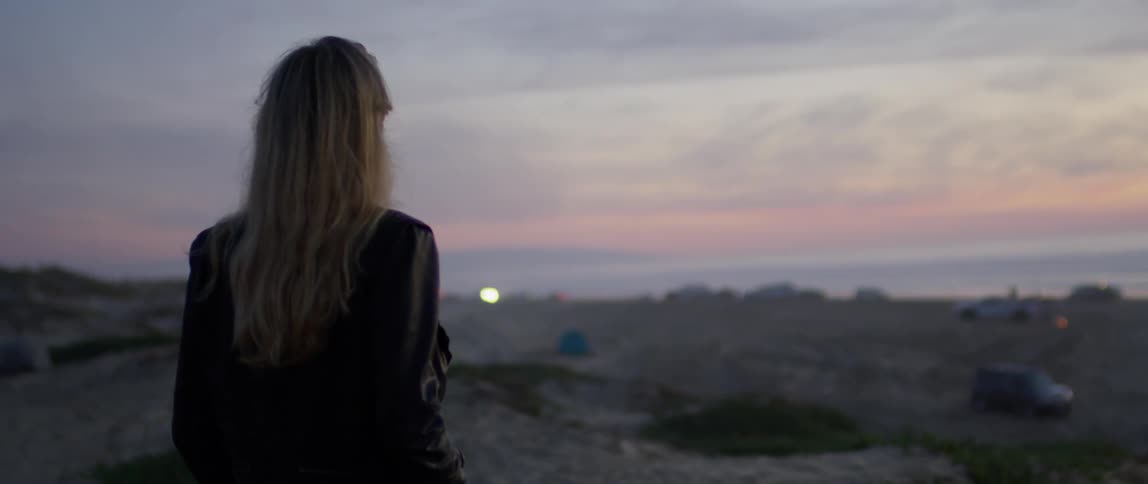 Woman Watching Sunset At Beach