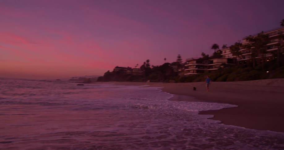 The ocean waves roll into the shore