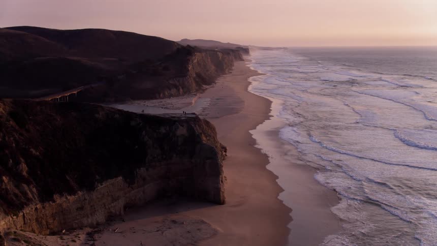The shore has rough waves at dawn