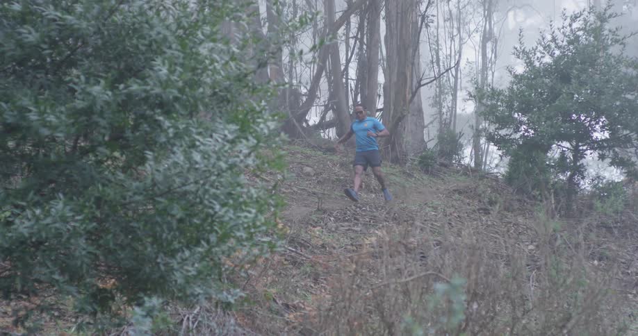 A man runs down the steep hill