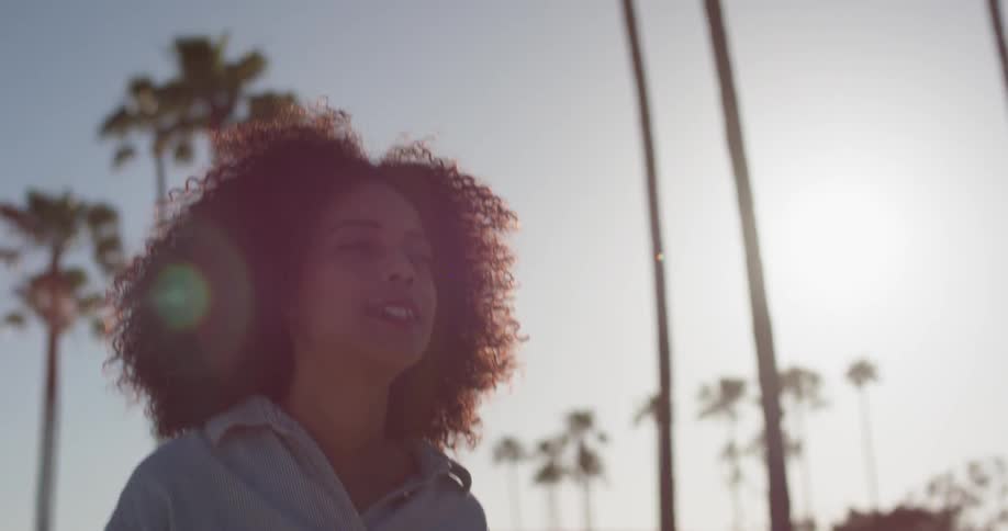 A woman travels on a sunny day