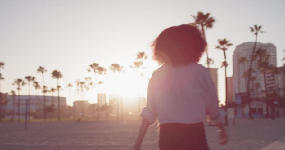 Woman Rollerblading Around Beach