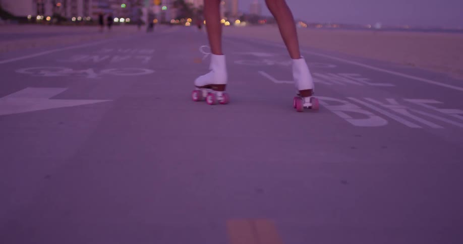 A person is roller skating by the beach