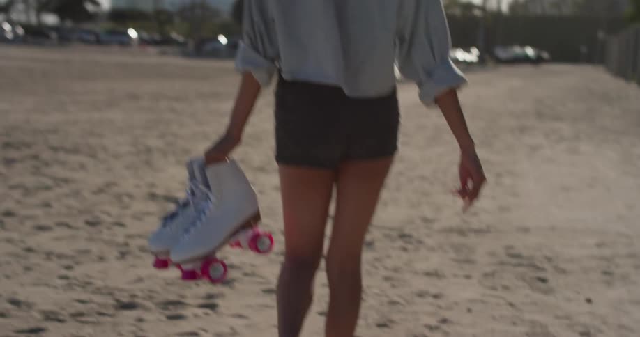 Woman Rollerblading Around Beach