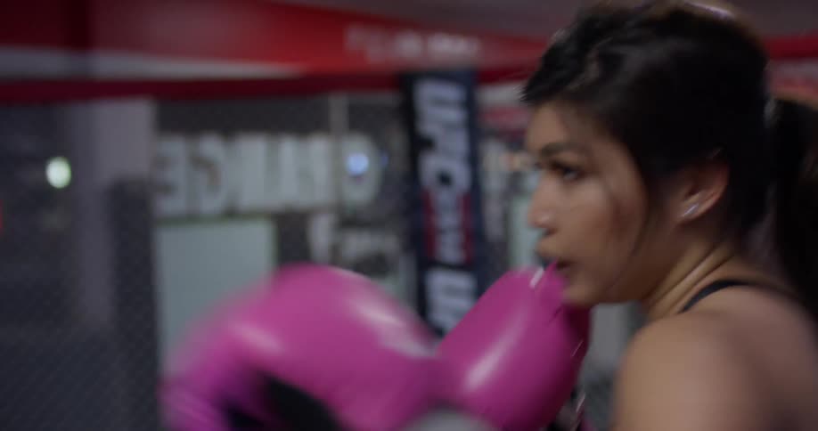A woman trains in a gym
