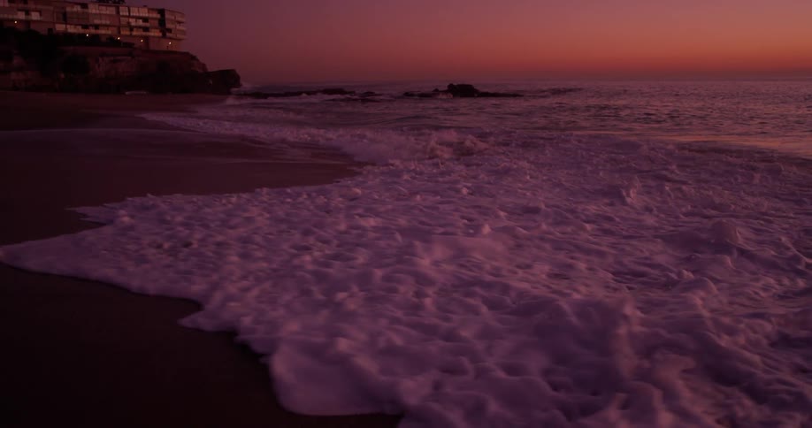 The water is bubbling as it hits the shore