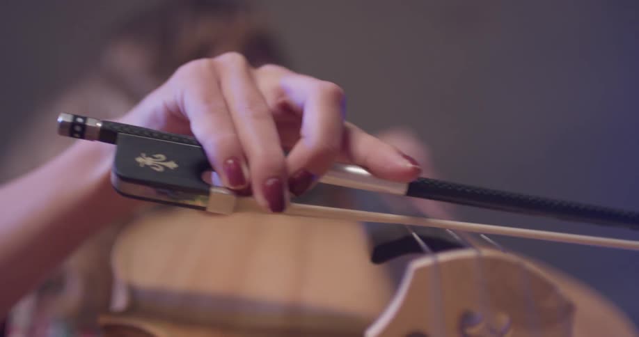 A woman plays a cello