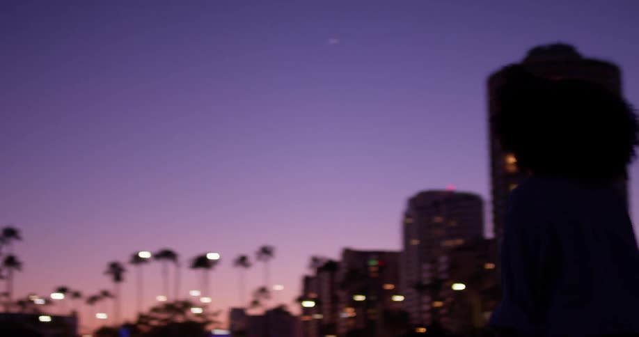The woman roller skates at dawn