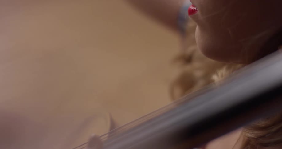 A woman is playing a musical instrument