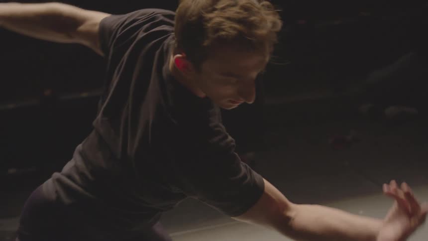 A man waves his arms dancing