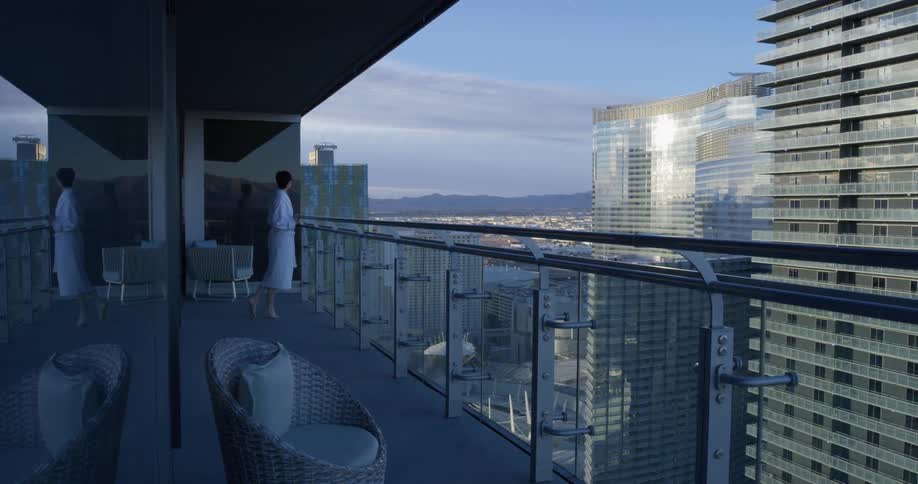 A woman stands on a hotel balcony in las vegas