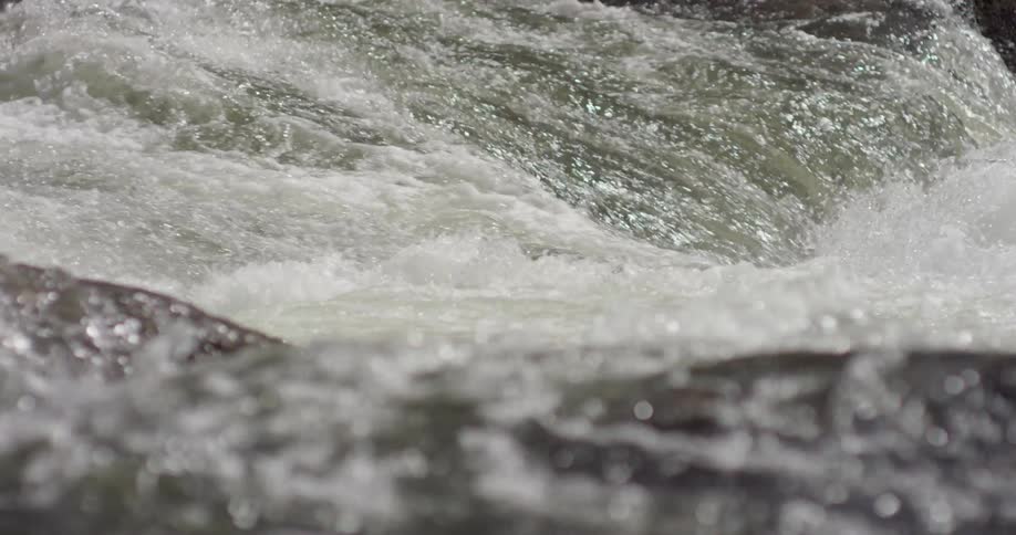The water moves quick over the rocks