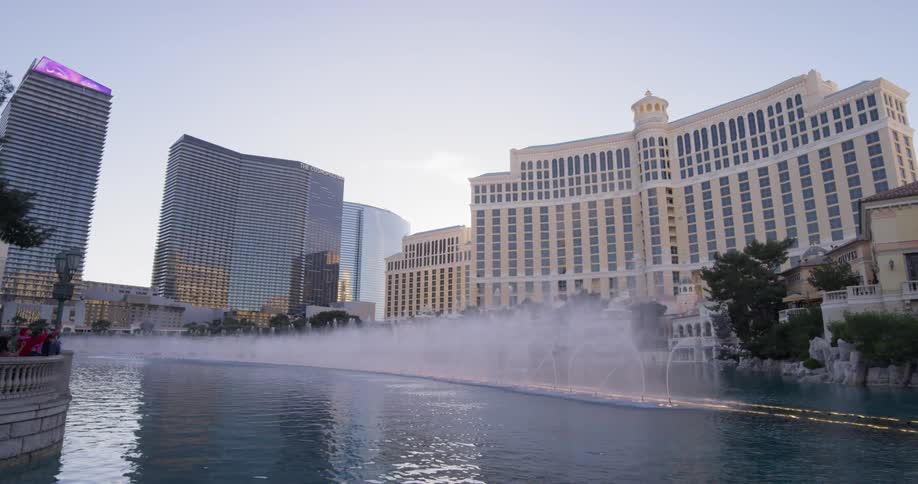 Water shoots up from the fountains in the lake in the city