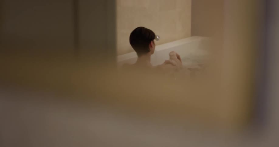 Woman bathes in a bathtub