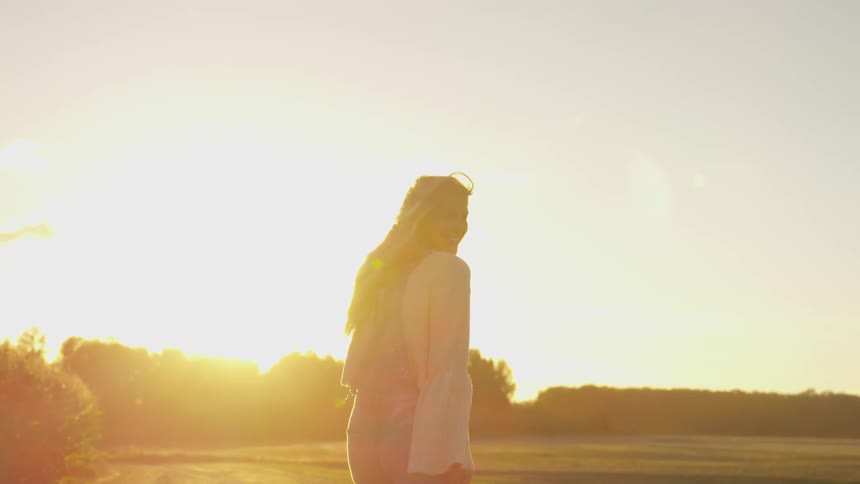 Woman walking in the country on a sunny day