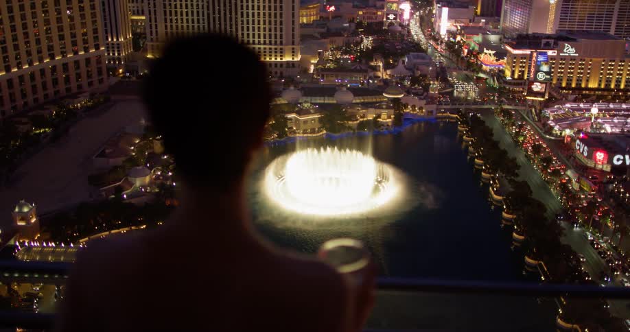 A woman stands on a hotel balcony in las vegas