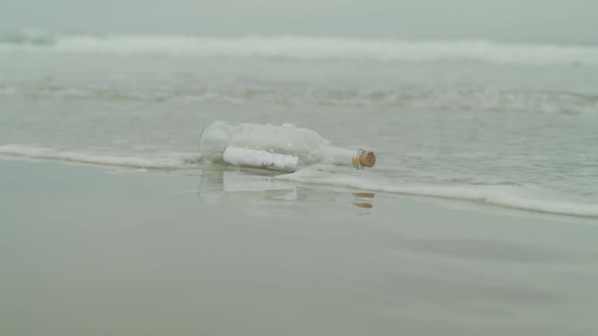 A Message In A Bottle On The Beach