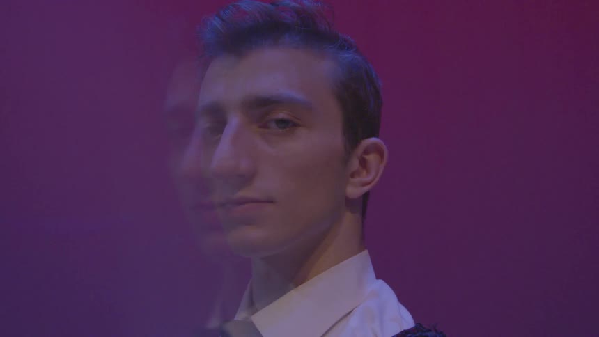 A man is looking to his side