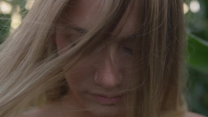 Wind blows through a woman's hair