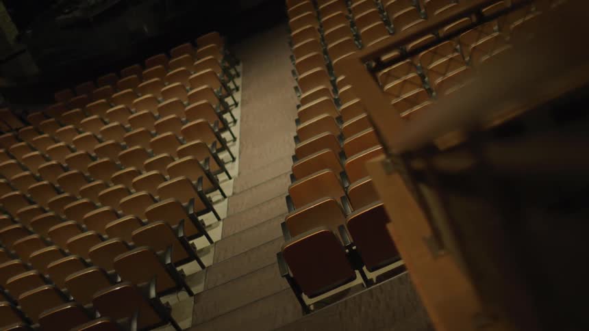 The seats in the auditorium are empty