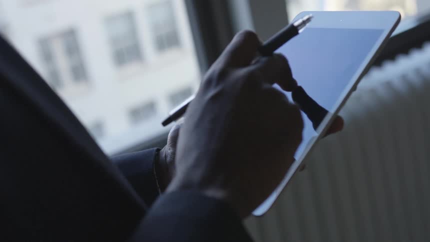 A man uses a tablet
