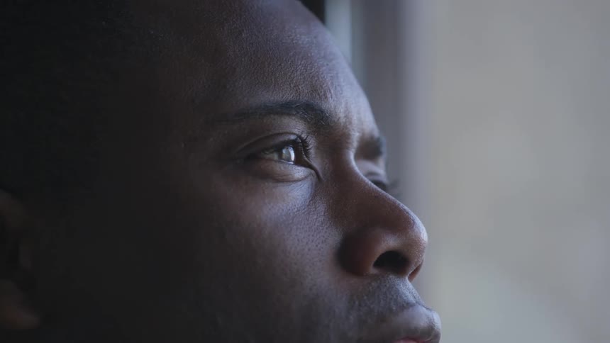 A man stares into the distance