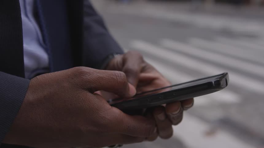 A man is using his phone