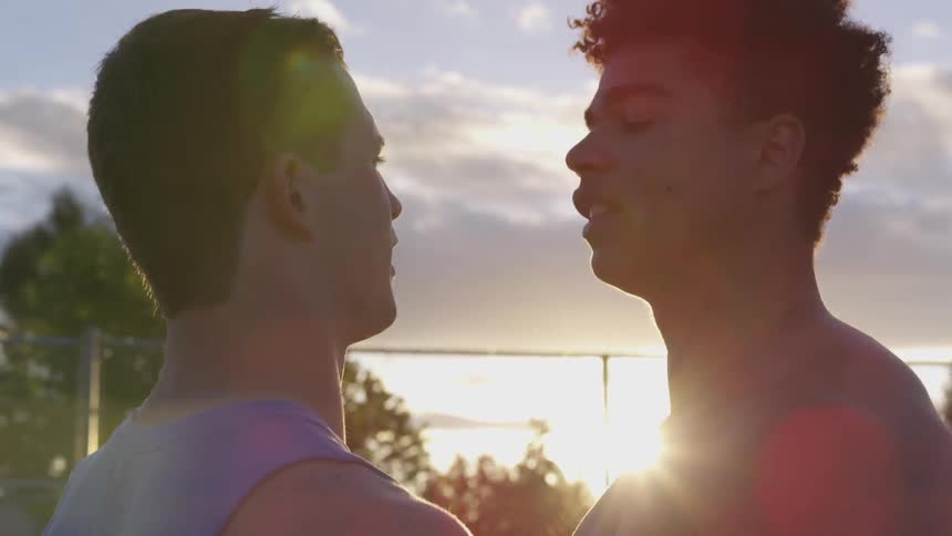 Two men argue outside