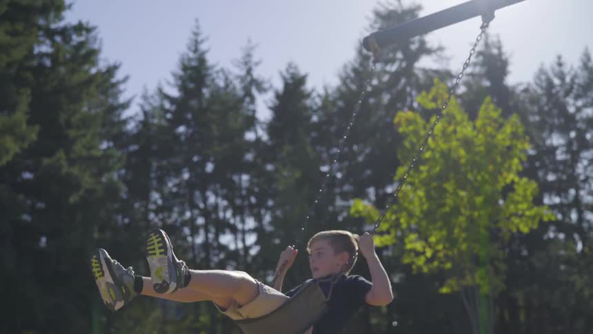 Boy Playing At A Park