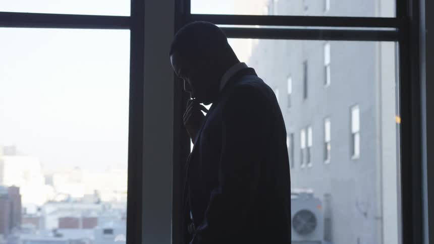 A man walks past the windows