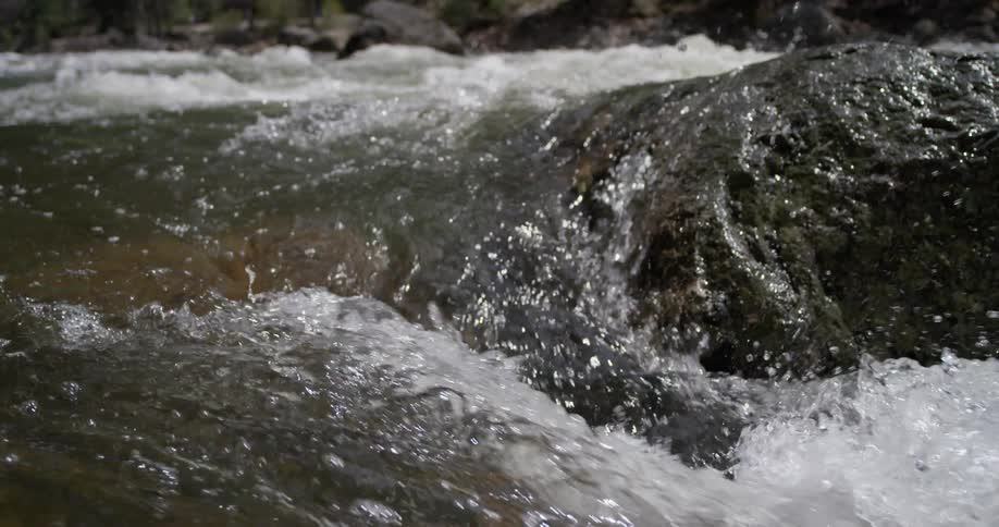 A river flows over a rock
