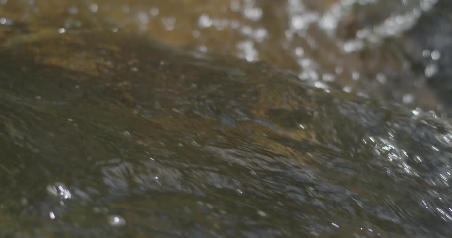 A river flows over a rock