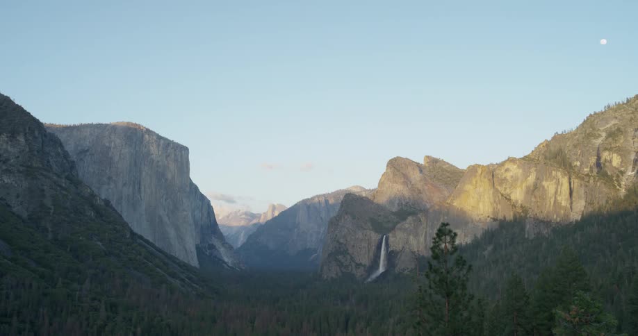 Mountains sit tall under the blue sky