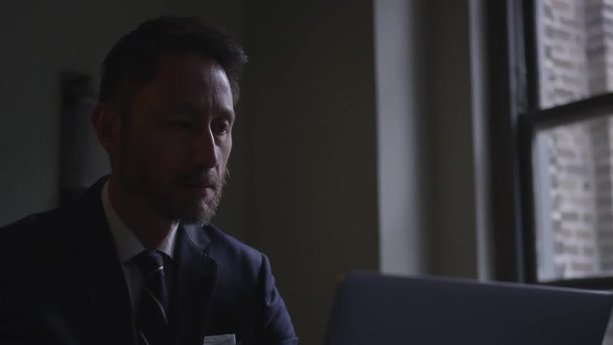 A businessman works in an office