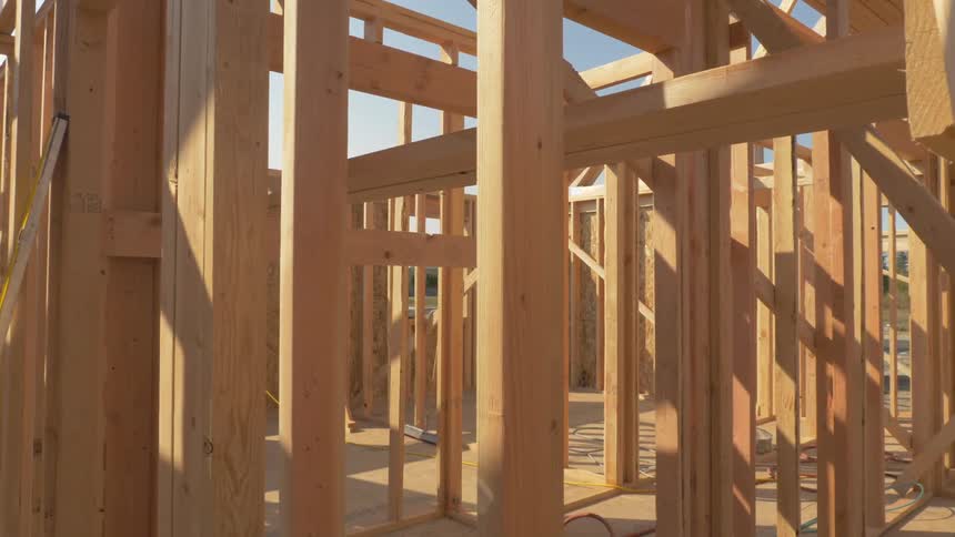 Construction site of house being built on sunny day