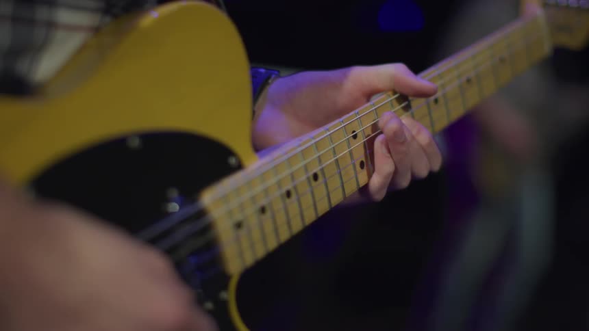 A person is playing the guitar